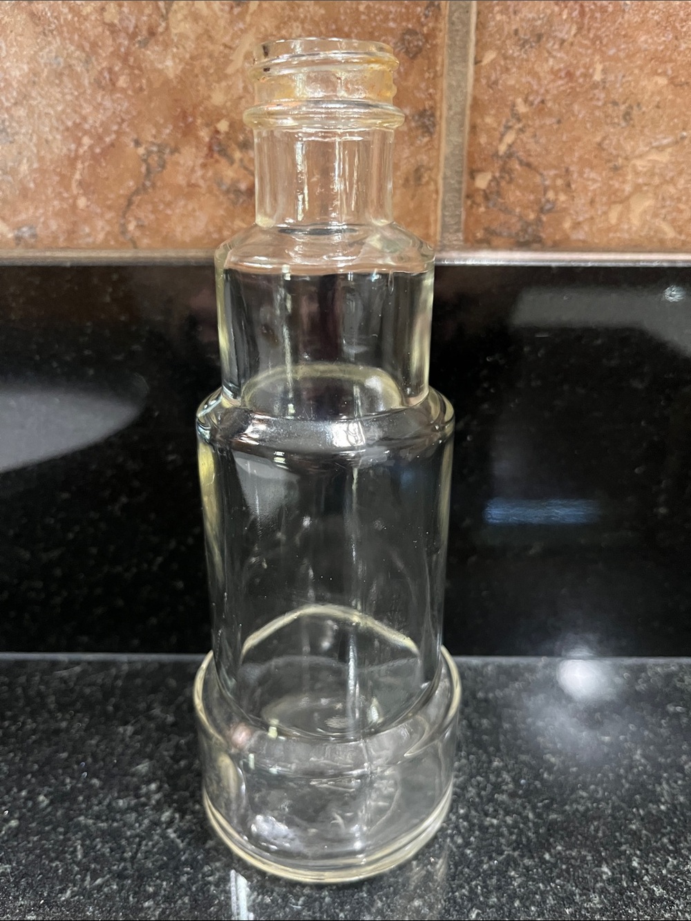 Vintage Clear Glass Decorative Bottle with a telescopic appearance
